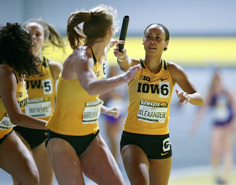 Iowa’s Anaya Alexander (right) hands the baton off to Mariel Bruxvoort as they run the women’s 1600 meter relay event during the Hawkeye Invitational at the Recreation Building in Iowa City on Saturday, January 11, 2020. (Stephen Mally/hawkeyesports.com)