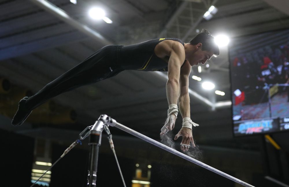 Iowa's Andrew Herrador competes on the high bar against the Ohio State Buckeyes Saturday, March 16, 2019 at Carver-Hawkeye Arena.  (Brian Ray/hawkeyesports.com)