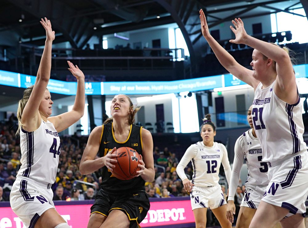 Iowa Hawkeyes forward Amanda Ollinger (43) drives to the basket for a score during the first quarter of their game at Welsh-Ryan Arena in Evanston, Ill. on Sunday, January 5, 2020. (Stephen Mally/hawkeyesports.com)