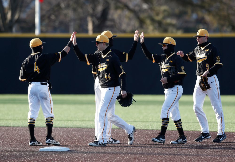 Iowa Hawkeyes infielder Mitchell Boe (4) and outfielder Robert Neustrom (44) against Grand View Wednesday, April 4, 2018 at Duane Banks Field. (Brian Ray/hawkeyesports.com)
