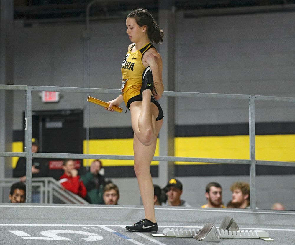 Iowa’s Jenny Kimbro stretches before the women’s 1600 meter relay premier event during the Larry Wieczorek Invitational at the Recreation Building in Iowa City on Saturday, January 18, 2020. (Stephen Mally/hawkeyesports.com)