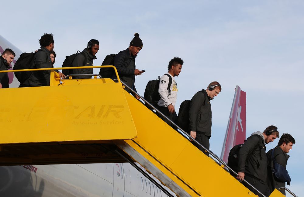 The Iowa Hawkeyes disembark the team plane Wednesday, December 26, 2018 as they arrive in Tampa, Florida for the Outback Bowl. (Brian Ray/hawkeyesports.com)