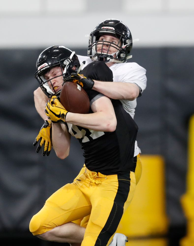Iowa Hawkeyes wide receiver Drew Thomas (41)  and defensive back John Milani (18) during spring practice  Thursday, March 29, 2018 at the Hansen Football Performance Center. (Brian Ray/hawkeyesports.com)