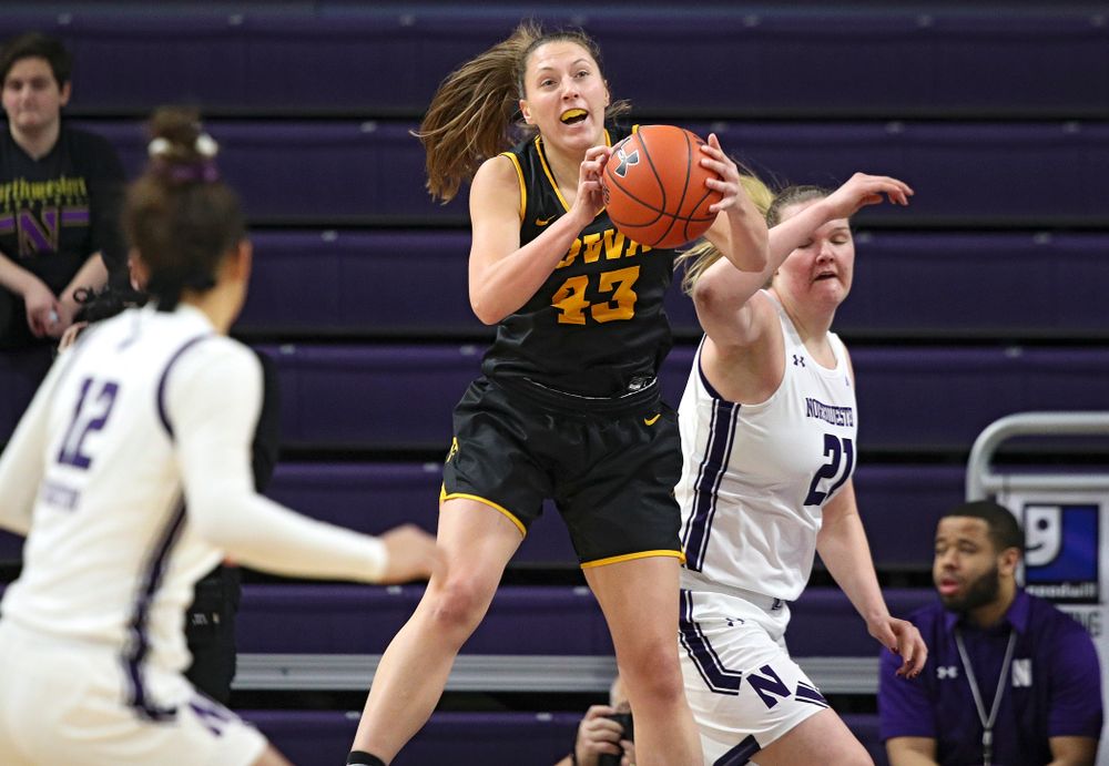 Iowa Hawkeyes forward Amanda Ollinger (43) pulls down a rebound during the first quarter of their game at Welsh-Ryan Arena in Evanston, Ill. on Sunday, January 5, 2020. (Stephen Mally/hawkeyesports.com)