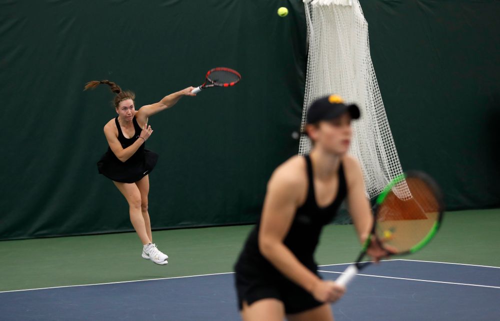 Elise Van Heuvelen and Anastasia Reimchen play a doubles match against Ohio State Sunday, March 25, 2018 at the Hawkeye Tennis and Recreation Center. (Brian Ray/hawkeyesports.com)
