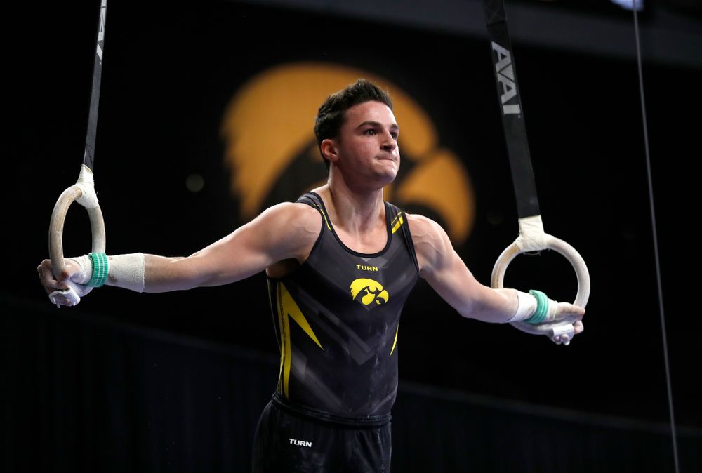 Jake Brodarzon competes on the rings against Illinois 