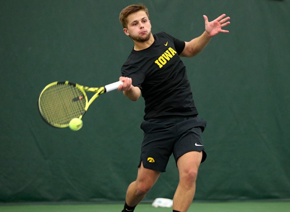 Iowa’s Will Davies returns a shot during his doubles match at the Hawkeye Tennis and Recreation Complex in Iowa City on Thursday, January 16, 2020. (Stephen Mally/hawkeyesports.com)