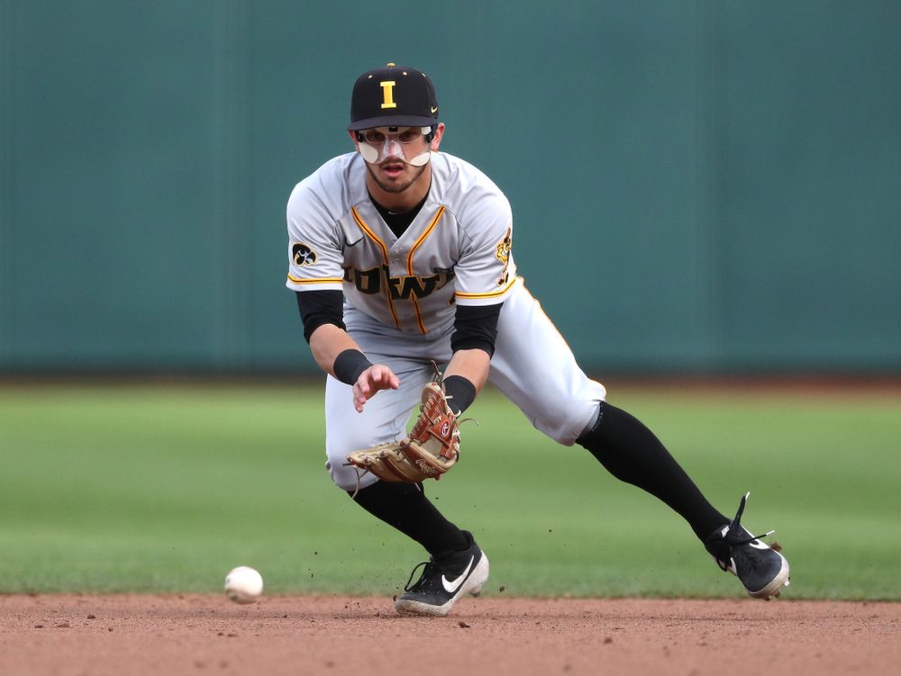 Iowa Hawkeyes infielder Mitchell Boe (4) turns a double play against the Indiana Hoosiers in the first round of the Big Ten Baseball Tournament Wednesday, May 22, 2019 at TD Ameritrade Park in Omaha, Neb. (Brian Ray/hawkeyesports.com)