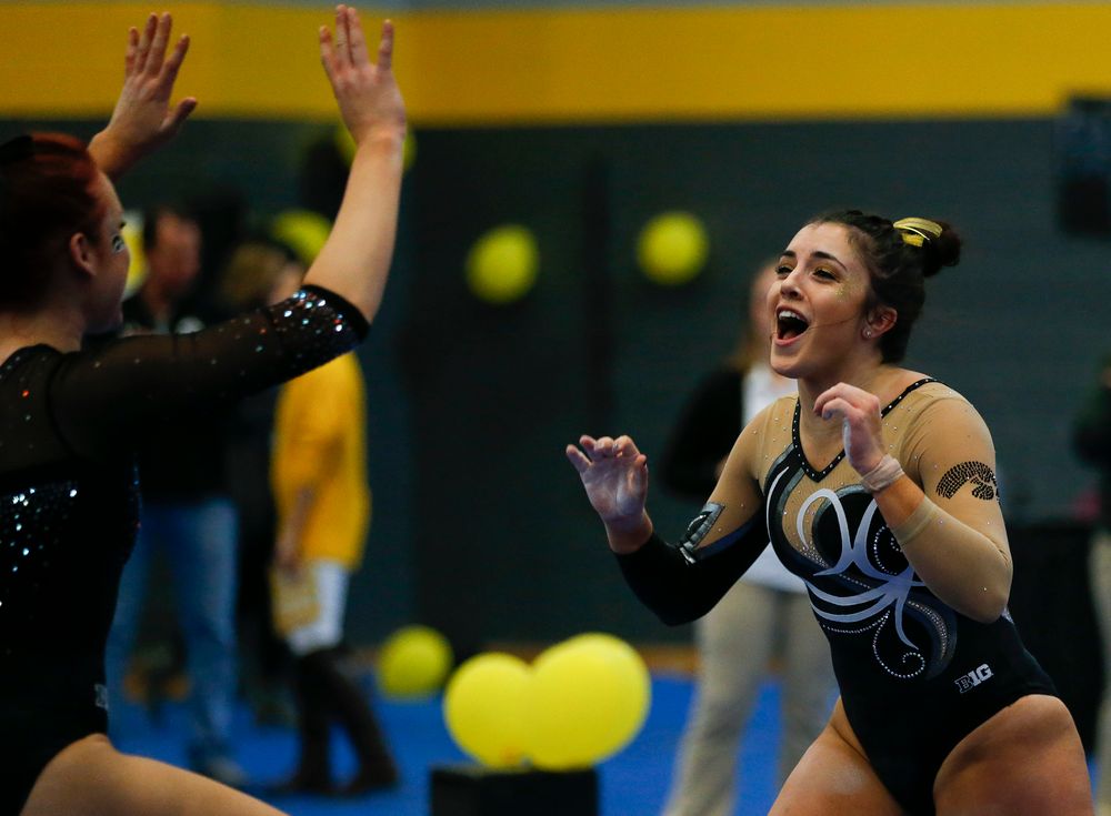 Nikki Youd celebrates after her balance beam routine during the Black and Gold Intrasquad meet at the Field House on 12/2/17. (Tork Mason/hawkeyesports.com)