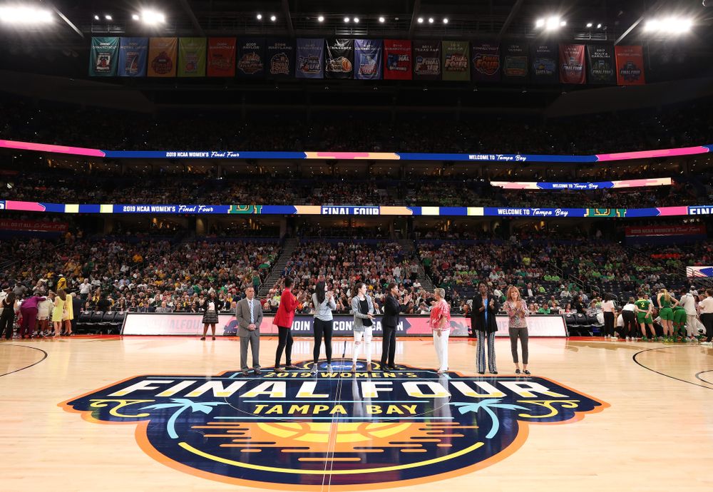 Iowa Hawkeyes forward Megan Gustafson (10) and Iowa State's Bridget Carleton are introduced with Naismith Starting 5 namesakes during a timeout in the second half of the National Semi-Final between Baylor and Oregon Friday, April 5, 2019 at Amalie Arena in Tampa, FL. (Brian Ray/hawkeyesports.com)
