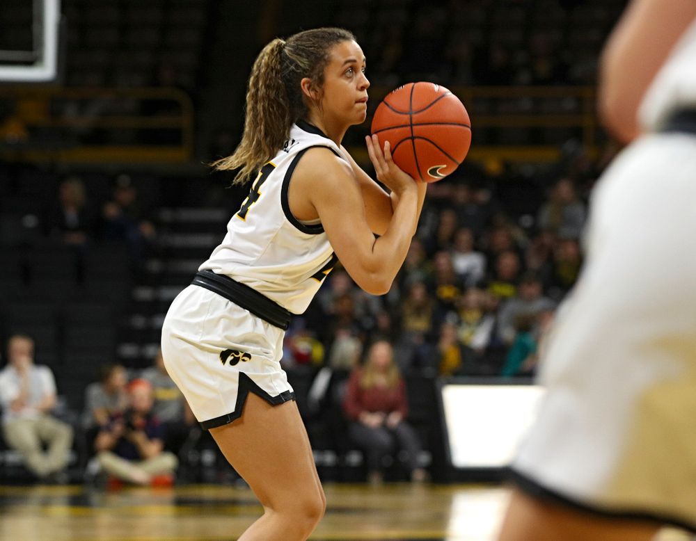 Iowa Hawkeyes guard Gabbie Marshall (24) lines up a 3-pointer during the third quarter of their game at Carver-Hawkeye Arena in Iowa City on Tuesday, December 31, 2019. (Stephen Mally/hawkeyesports.com)