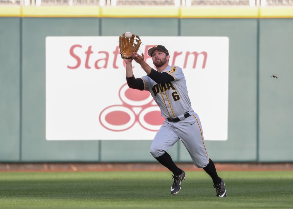 Iowa Hawkeyes outfielder Justin Jenkins (6) catches a fly ball against the Indiana Hoosiers in the first round of the Big Ten Baseball Tournament Wednesday, May 22, 2019 at TD Ameritrade Park in Omaha, Neb. (Brian Ray/hawkeyesports.com)