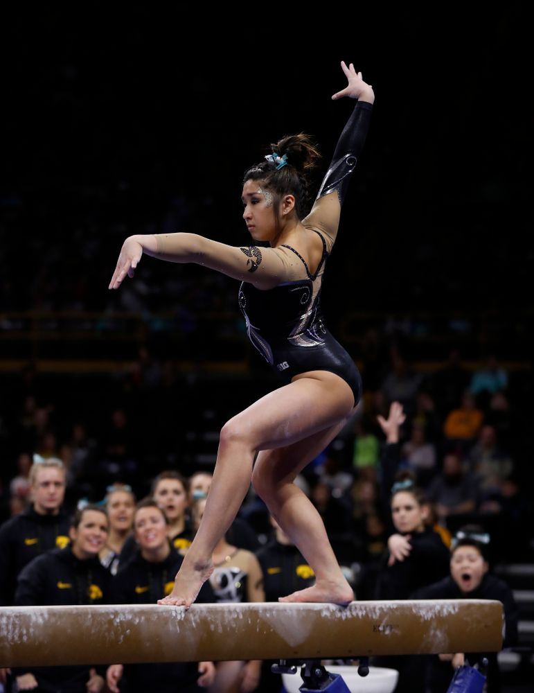 Iowa's Nicole Chow competes on the beam against the Nebraska Cornhuskers 