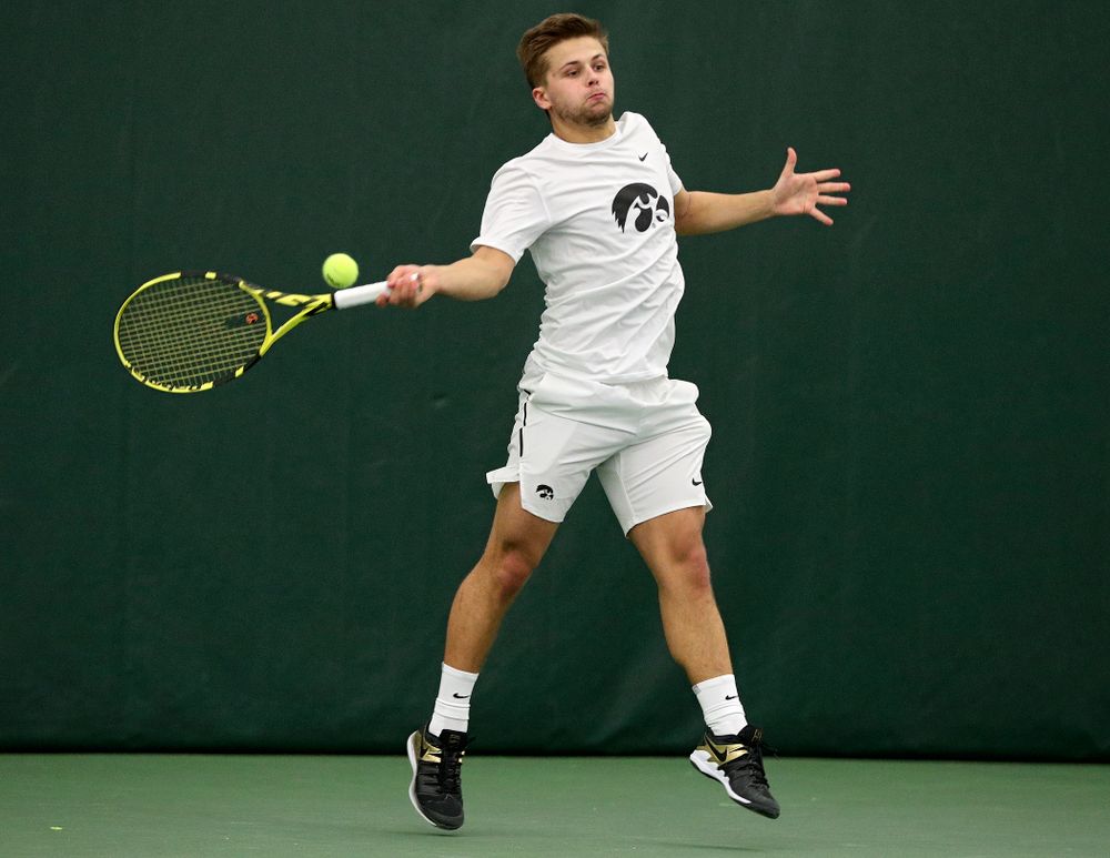 Iowa’s Will Davies returns a shot during his singles match at the Hawkeye Tennis and Recreation Complex in Iowa City on Sunday, February 16, 2020. (Stephen Mally/hawkeyesports.com)