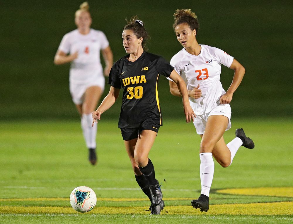 Iowa forward Devin Burns (30) looks down field as she moves with the ball during the first half of their match against Illinois at the Iowa Soccer Complex in Iowa City on Thursday, Sep 26, 2019. (Stephen Mally/hawkeyesports.com)