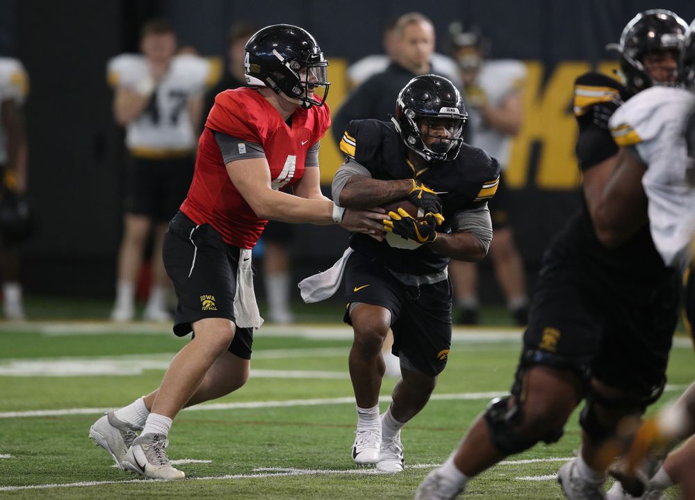 Iowa Hawkeyes quarterback Nate Stanley (4) and running back Mekhi Sargent (10) during preparation for the 2019 Outback Bowl Monday, December 17, 2018 at the Hansen Football Performance Center. (Brian Ray/hawkeyesports.com)
