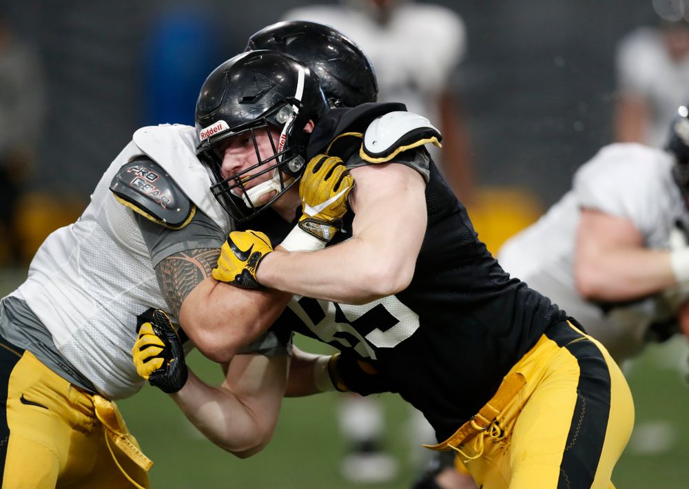 Iowa Hawkeyes tight end Nate Vejvoda (85) and defensive end A.J. Epenesa (94) during spring practice Wednesday, March 28, 2018 at the Hansen Football Performance Center.  (Brian Ray/hawkeyesports.com)