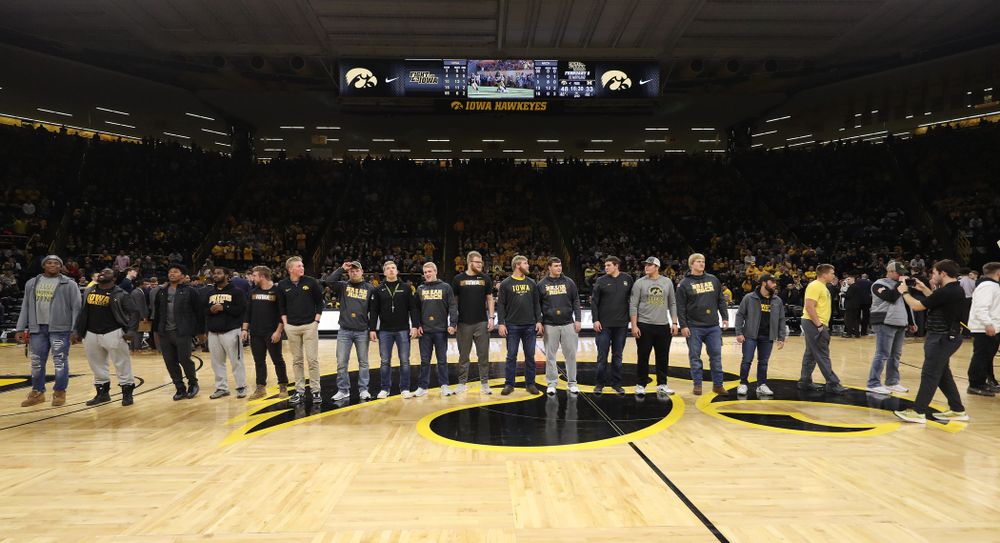 The Hawkeye Football team is introduced during a timeout of the Iowa Hawkeyes game against the Michigan Wolverines Friday, February 1, 2019 at Carver-Hawkeye Arena. (Brian Ray/hawkeyesports.com)