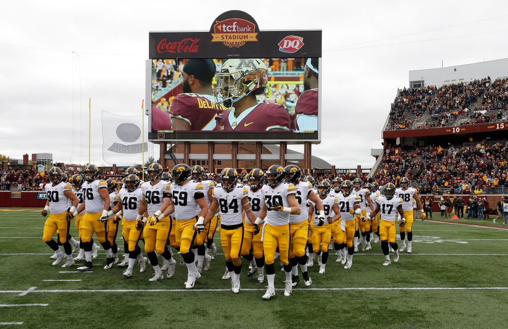 The Iowa Hawkeyes swarm out for their game against the Minnesota Golden Gophers Saturday, October 6, 2018 at TCF Bank Stadium. (Brian Ray/hawkeyesports.com)