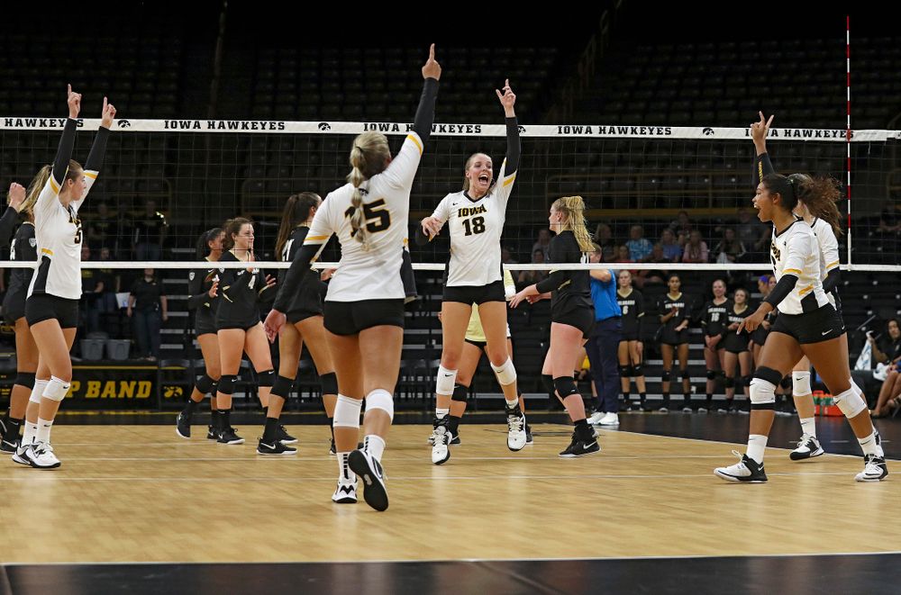 Iowa’s Meghan Buzzerio (5), Maddie Slagle (15), Hannah Clayton (18), Brie Orr (7), and Courtney Buzzerio (2) celebrate a score during the first set of their Big Ten/Pac-12 Challenge match against Colorado at Carver-Hawkeye Arena in Iowa City on Friday, Sep 6, 2019. (Stephen Mally/hawkeyesports.com)