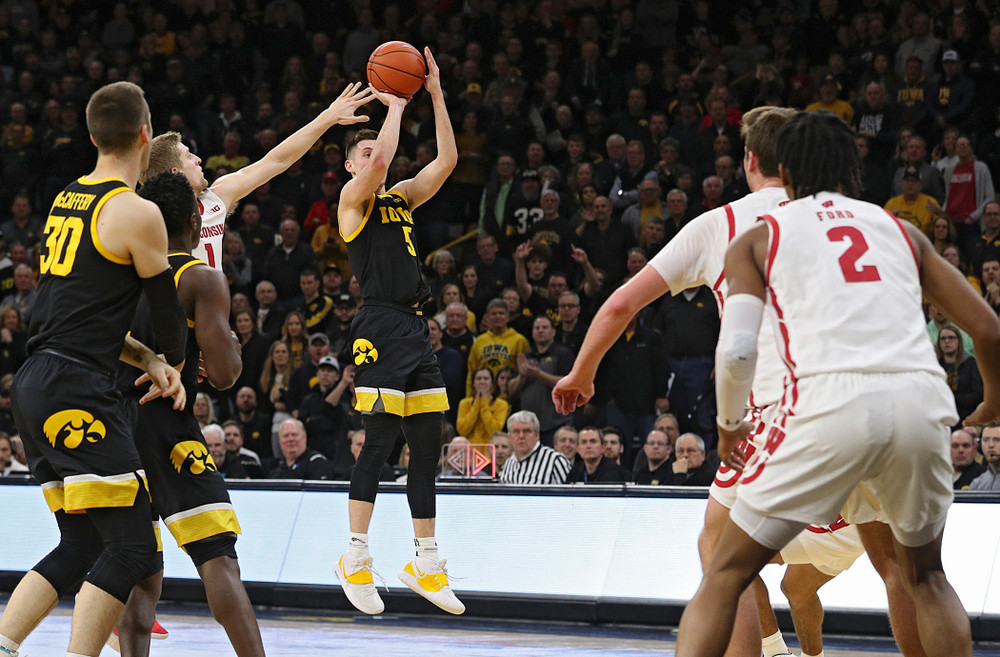 Iowa Hawkeyes guard CJ Fredrick (5) makes a 3-pointer during the second half of their game at Carver-Hawkeye Arena in Iowa City on Monday, January 27, 2020. (Stephen Mally/hawkeyesports.com)