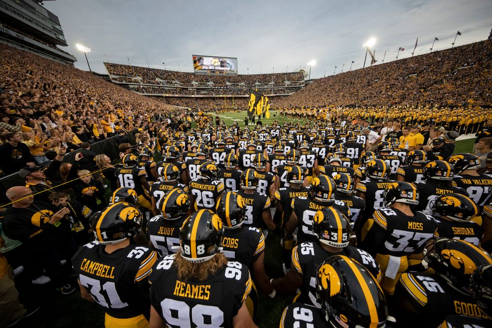 The Iowa Hawkeyes swarm onto the field for their game against the Miami RedHawks Saturday, August 31, 2019 at Kinnick Stadium in Iowa City. (Brian Ray/hawkeyesports.com)