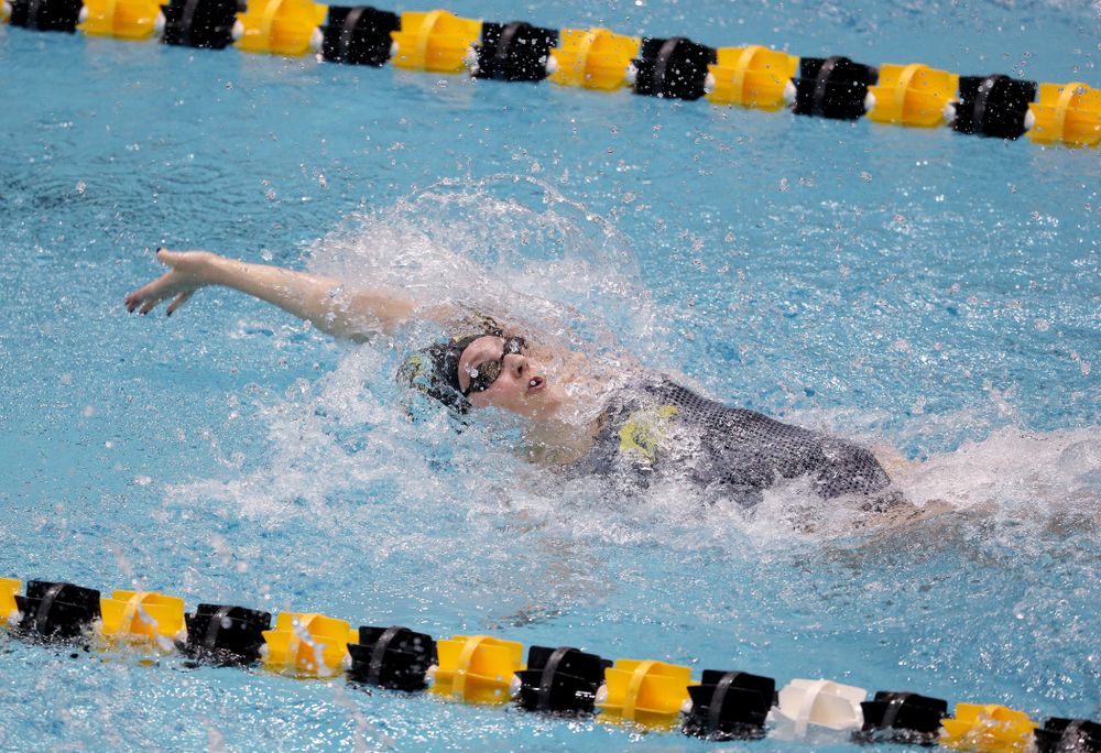 IowaÕs Emilia Sansome competes in the 100 yard backstroke against Notre Dame and Illinois Saturday, January 11, 2020 at the Campus Recreation and Wellness Center.  (Brian Ray/hawkeyesports.com)