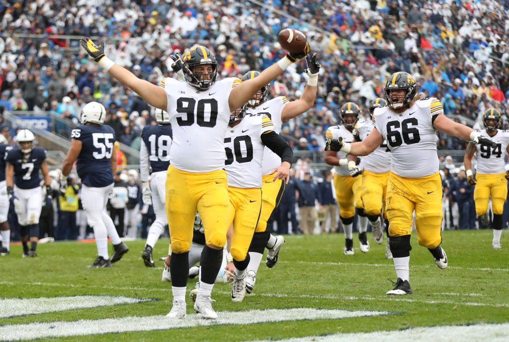 Iowa Hawkeyes defensive end Sam Brincks (90) catches a touchdown pass against the Penn State Nittany Lions Saturday, October 27, 2018 at Beaver Stadium in University Park, Pa. (Max Allen/hawkeyesports.com)