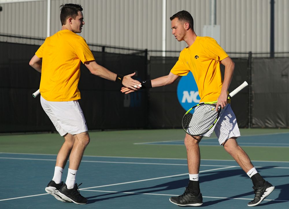 Iowa's Jonas Larsen (from left) and Kareem Allaf celebrate a point during their doubles match again Michigan State at the Hawkeye Tennis and Recreation Complex in Iowa City on Friday, Apr. 19, 2019. (Stephen Mally/hawkeyesports.com)
