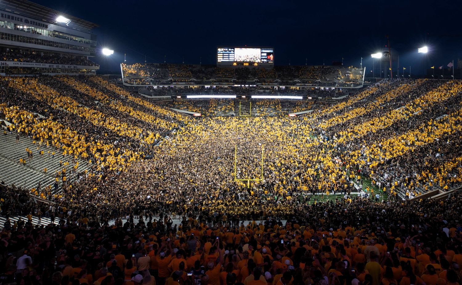 Iowa fans storm the field after beating then #4 Penn State