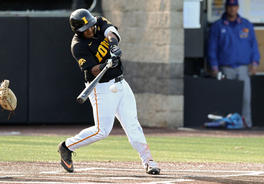 Iowa infielder Izaya Fullard (20) drives a pitch for a hit during the third inning of their college baseball game at Duane Banks Field in Iowa City on Tuesday, March 10, 2020. (Stephen Mally/hawkeyesports.com)