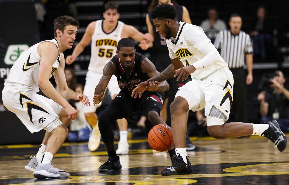 Iowa Hawkeyes guard Isaiah Moss (4) steals the ball during a game against Guilford College at Carver-Hawkeye Arena on November 4, 2018. (Tork Mason/hawkeyesports.com)