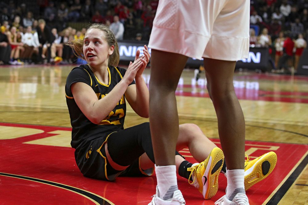 Iowa guard Kathleen Doyle (22) claps as she sits on the court after being fouled during the second quarter of their game at the Rutgers Athletic Center in Piscataway, N.J. on Sunday, March 1, 2020. (Stephen Mally/hawkeyesports.com)