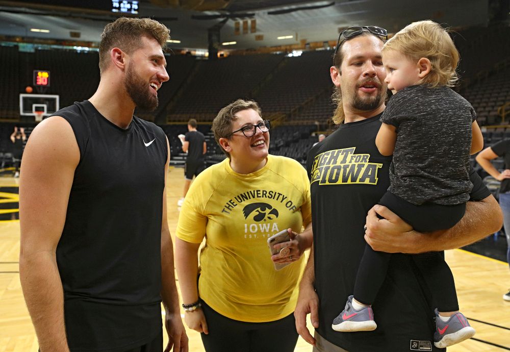 Iowa Hawkeyes guard Jordan Bohannon (3) talks with visitors from University of Iowa Hospitals and Clinics Adolescent and Young Adult (AYA) Cancer Program after practice at Carver-Hawkeye Arena in Iowa City on Monday, Sep 30, 2019. (Stephen Mally/hawkeyesports.com)