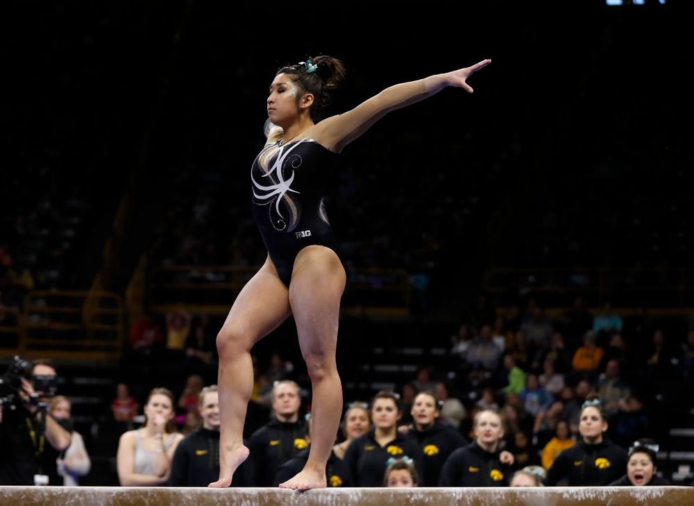 Iowa's Nicole Chow competes on the beam against the Nebraska Cornhuskers 