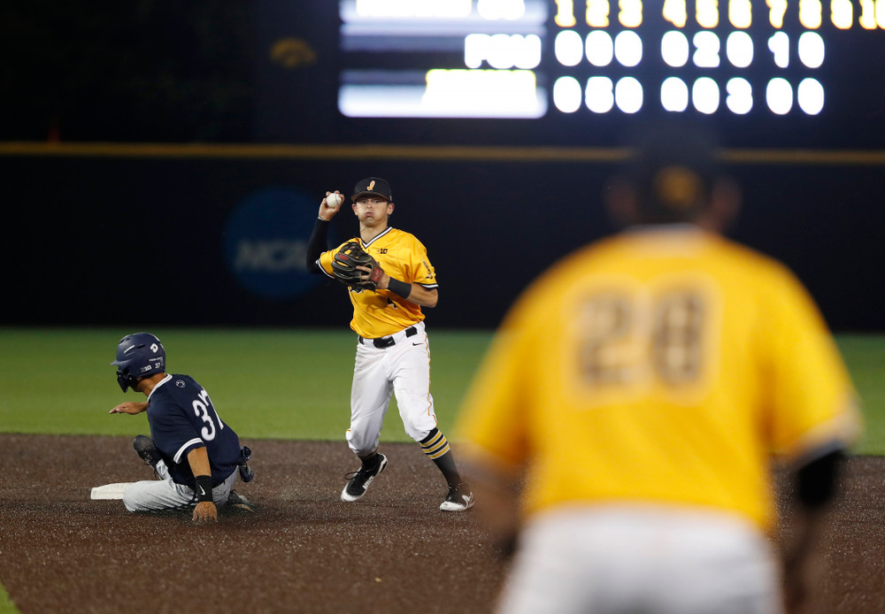 Iowa Hawkeyes infielder Mitchell Boe (4) turns a game ending double play against the Penn State Nittany Lions Saturday, May 19, 2018 at Duane Banks Field. (Brian Ray/hawkeyesports.com)