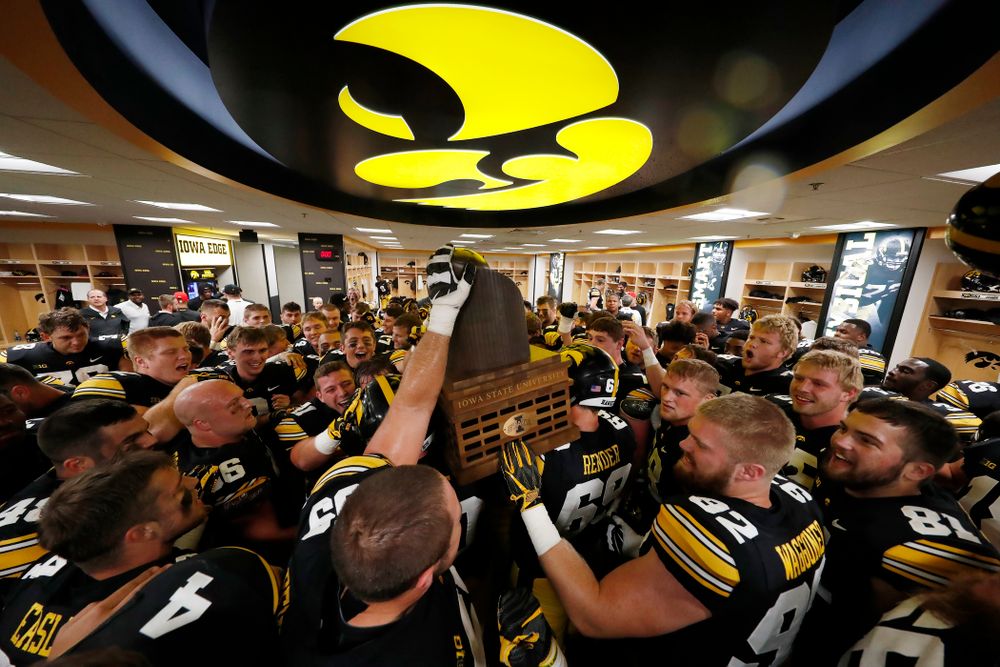 The Iowa Hawkeyes celebrate with the Cy-Hawk trophy following their game against the Iowa State Cyclones Saturday, September 8, 2018 at Kinnick Stadium. (Brian Ray/hawkeyesports.com)