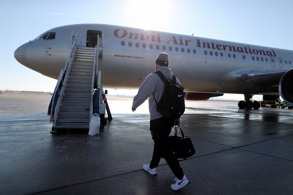 Iowa Hawkeyes defensive lineman Brady Reiff (91) boards the team plane at the Eastern Iowa Airport Saturday, December 21, 2019 on the way to San Diego, CA for the Holiday Bowl. (Brian Ray/hawkeyesports.com)