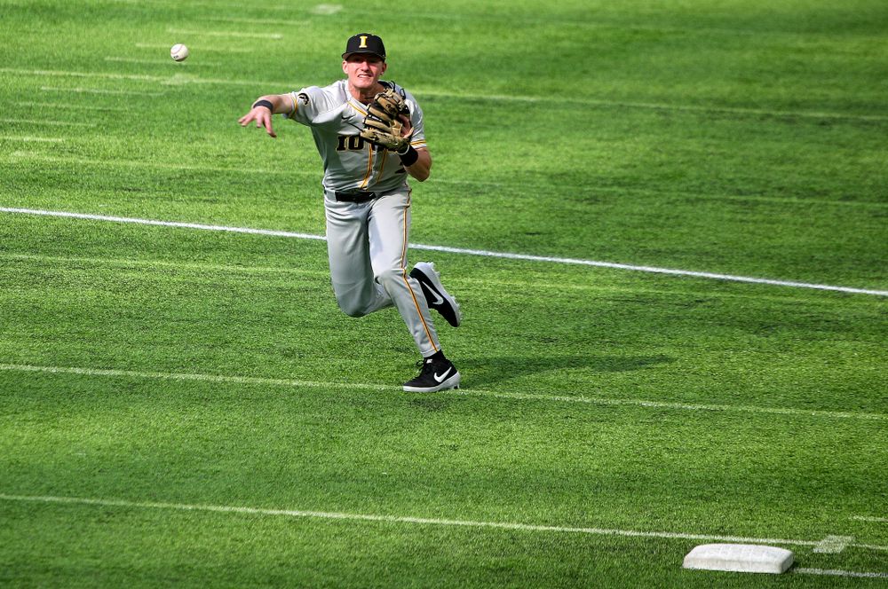 Iowa Hawkeyes infielder Brendan Sher (2) throws to first during the first inning of their CambriaCollegeClassic game at U.S. Bank Stadium in Minneapolis, Minn. on Friday, February 28, 2020. (Stephen Mally/hawkeyesports.com)