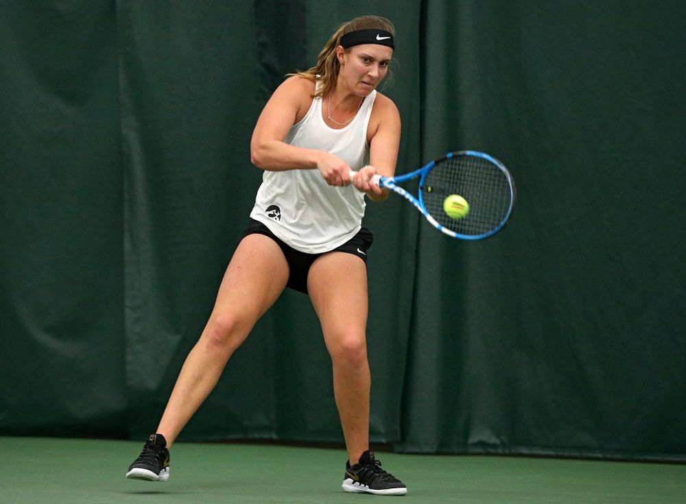 Iowa’s Ashleigh Jacobs returns a shot during her singles match at the Hawkeye Tennis and Recreation Complex in Iowa City on Sunday, February 23, 2020. (Stephen Mally/hawkeyesports.com)