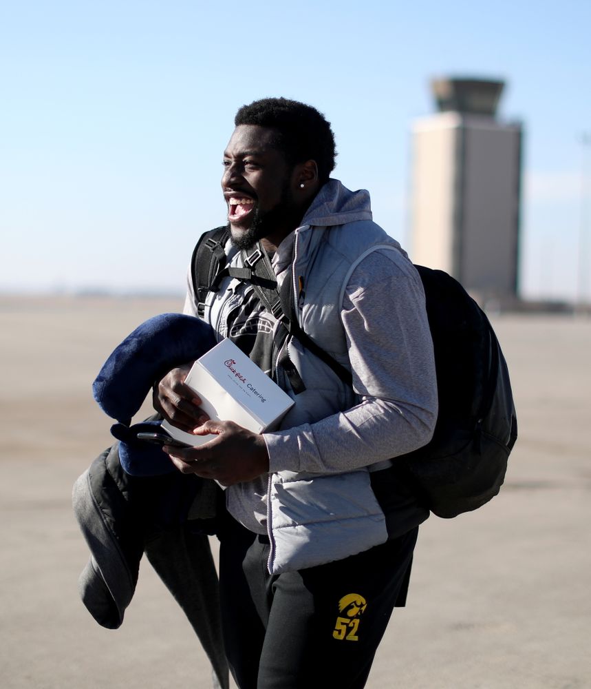 Iowa Hawkeyes linebacker Amani Jones (52) boards the team plane at the Eastern Iowa Airport Saturday, December 21, 2019 on the way to San Diego, CA for the Holiday Bowl. (Brian Ray/hawkeyesports.com)