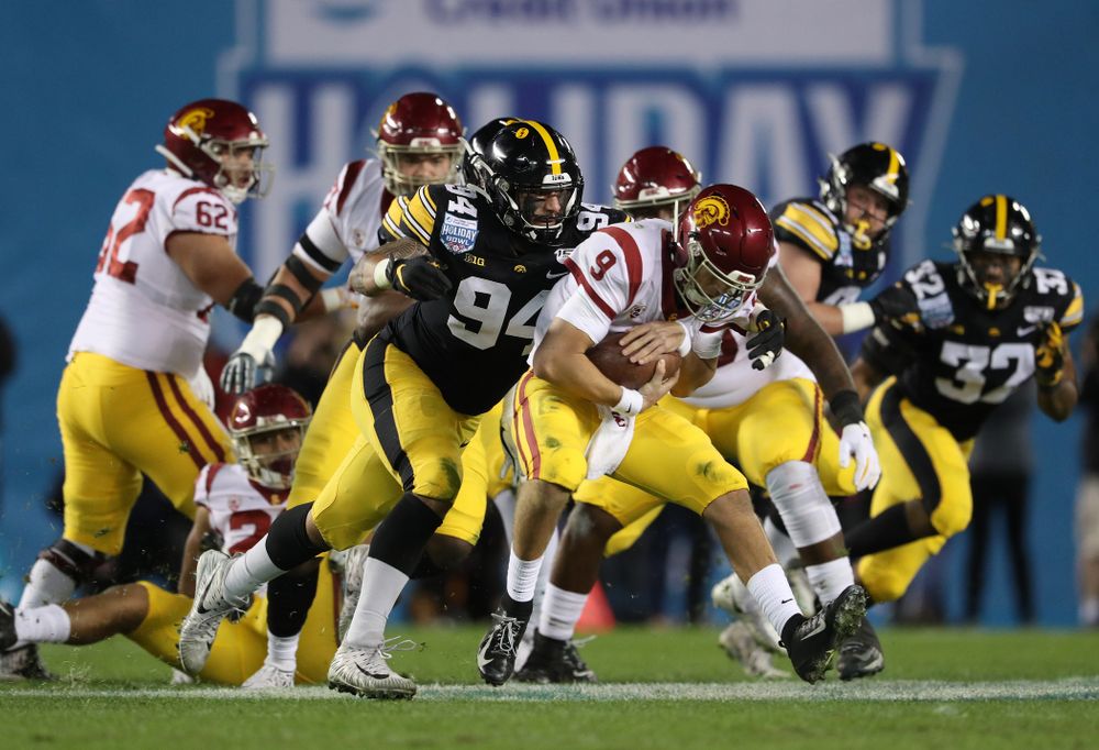 Iowa Hawkeyes defensive end A.J. Epenesa (94) gets a sack against USC in the Holiday Bowl Friday, December 27, 2019 at San Diego Community Credit Union Stadium.  (Brian Ray/hawkeyesports.com)