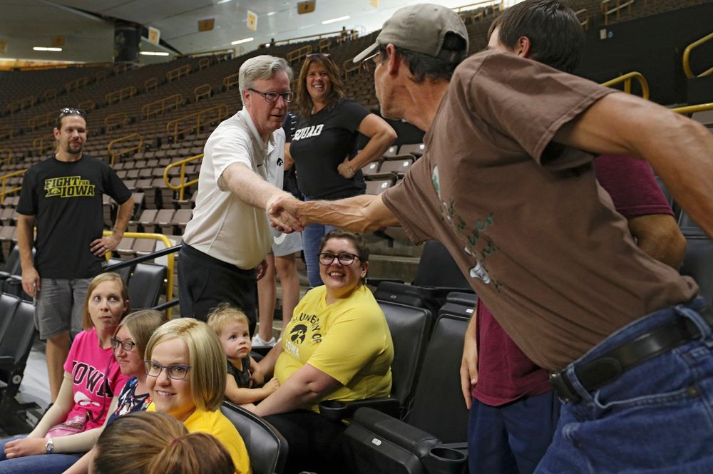 Iowa Hawkeyes head coach Fran McCaffery meets visitors from the University of Iowa Hospitals and Clinics Adolescent and Young Adult (AYA) Cancer Program during practice at Carver-Hawkeye Arena in Iowa City on Monday, Sep 30, 2019. (Stephen Mally/hawkeyesports.com)