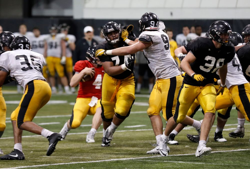 Iowa Hawkeyes offensive lineman Tristan Wirfs (74) and defensive end A.J. Epenesa (94) during spring practice No. 13 Wednesday, April 18, 2018 at the Hansen Football Performance Center. (Brian Ray/hawkeyesports.com)