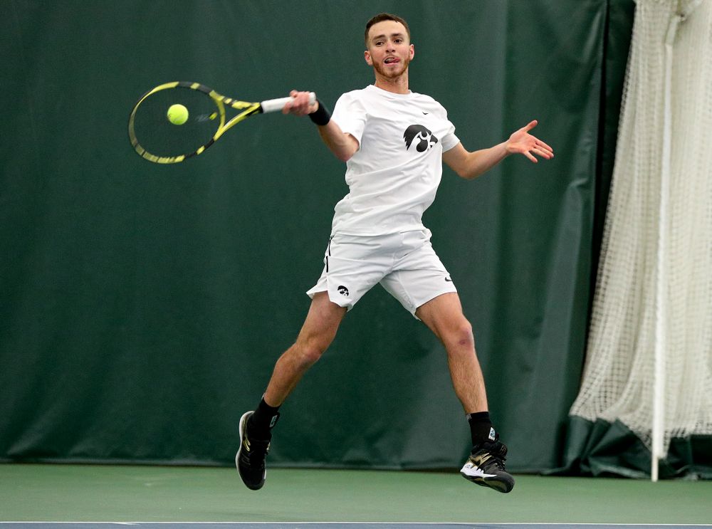 Iowa’s Kareem Allaf returns a shot during his singles match at the Hawkeye Tennis and Recreation Complex in Iowa City on Sunday, February 16, 2020. (Stephen Mally/hawkeyesports.com)