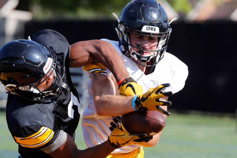 Iowa Hawkeyes defensive back Riley Moss (33) and wide receiver Tyrone Tracy Jr. (3) during camp practice No. 17 Wednesday, August 22, 2018 at the Kenyon Football Practice Facility. (Brian Ray/hawkeyesports.com)