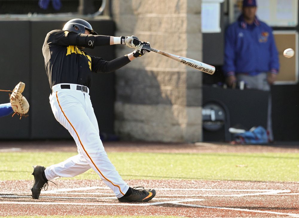 Iowa outfielder Ben Norman (9) drives a pitch for a hit during the first inning of their college baseball game at Duane Banks Field in Iowa City on Tuesday, March 10, 2020. (Stephen Mally/hawkeyesports.com)