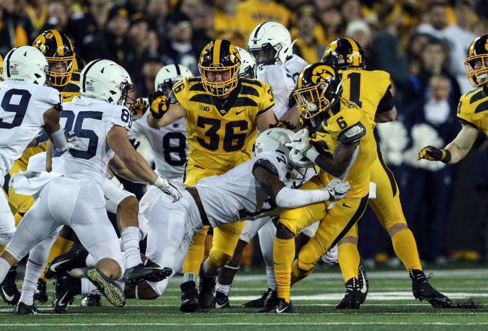Iowa Hawkeyes fullback Brady Ross (36) blocks for wide receiver Ihmir Smith-Marsette (6) as he returns a kick against the Penn State Nittany Lions Saturday, October 12, 2019 at Kinnick Stadium. (Brian Ray/hawkeyesports.com)