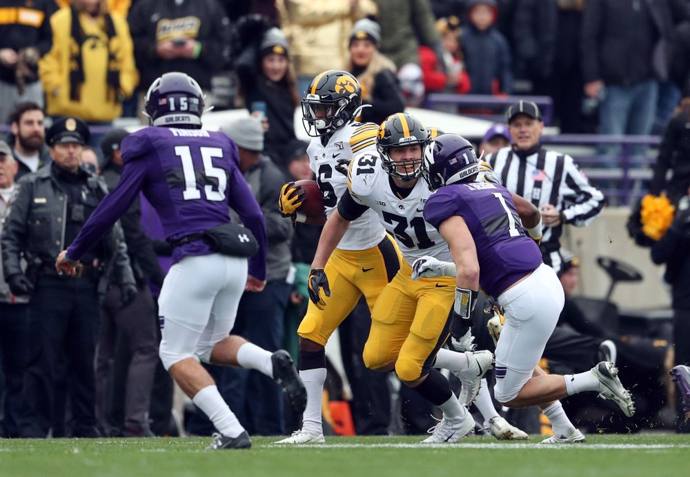 Iowa Hawkeyes wide receiver Ihmir Smith-Marsette (6) and linebacker Jack Campbell (31) against the Northwestern Wildcats Saturday, October 26, 2019 at Ryan Field in Evanston, Ill. (Brian Ray/hawkeyesports.com)