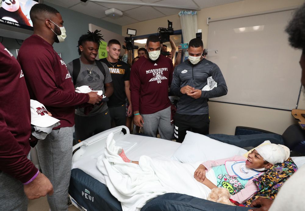 Iowa Hawkeyes linebacker Jayden McDonald (26) and wide receiver Blair Brooks (83) visit patients with players from Mississippi State during a visit to Tampa General Hospital as part of the Outback Bowl Friday, December 28, 2018 in Tampa, FL.(Brian Ray/hawkeyesports.com)